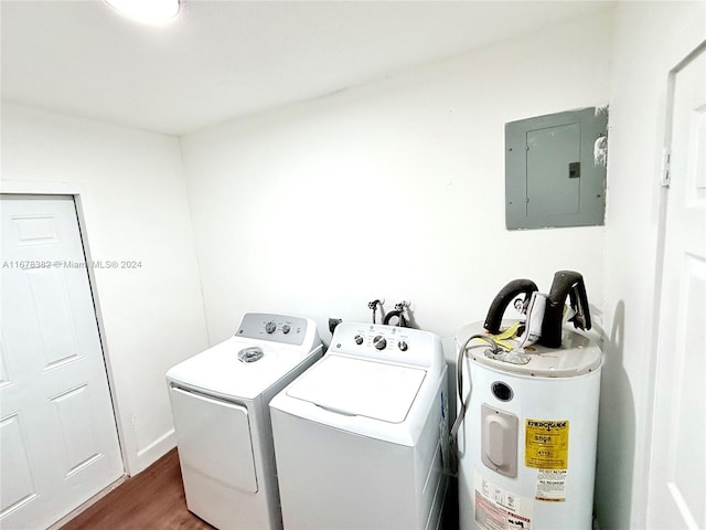 laundry area featuring water heater, electric panel, dark hardwood / wood-style floors, and separate washer and dryer