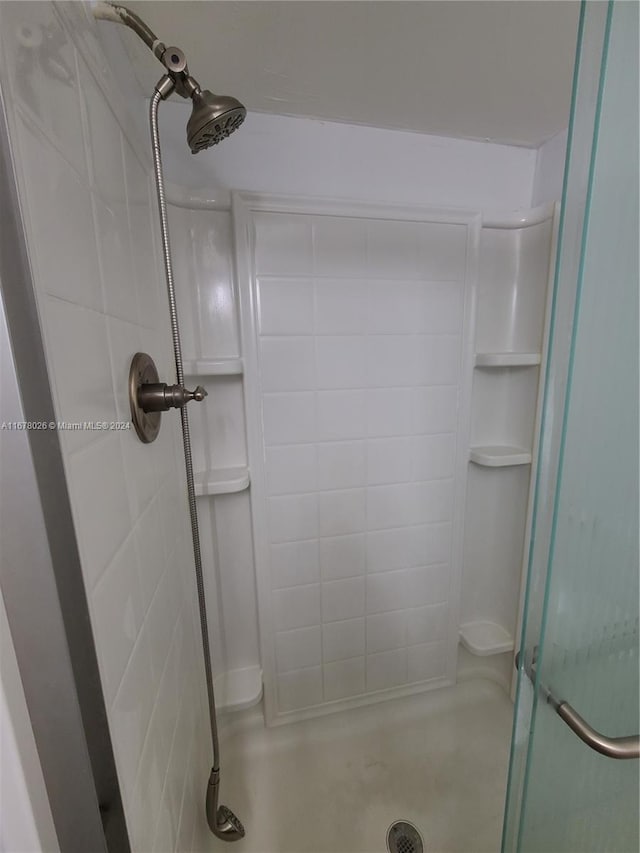 bathroom with tiled shower