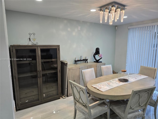 dining space featuring a chandelier and light wood-type flooring