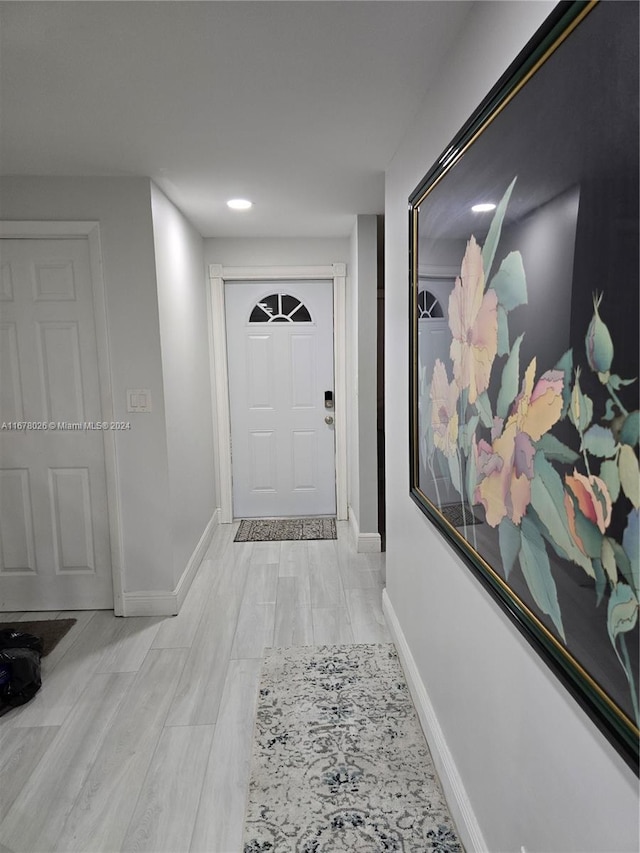 hallway with light wood-type flooring