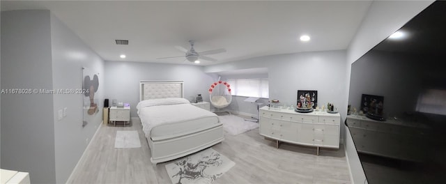 bedroom with light hardwood / wood-style flooring and ceiling fan