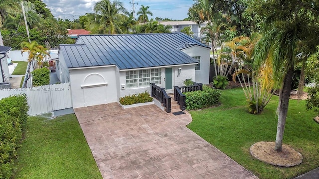 view of front of house with a front lawn and a garage