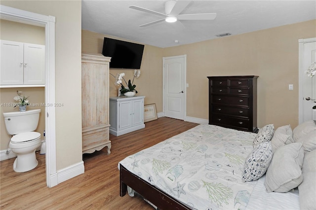 bedroom with connected bathroom, ceiling fan, and light wood-type flooring