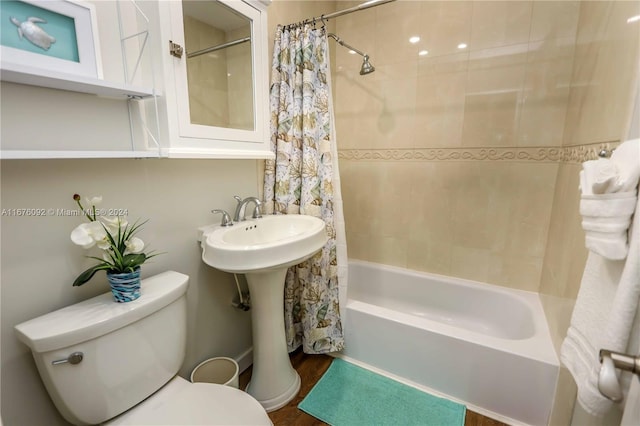 full bathroom featuring shower / bath combination with curtain, toilet, hardwood / wood-style flooring, and sink