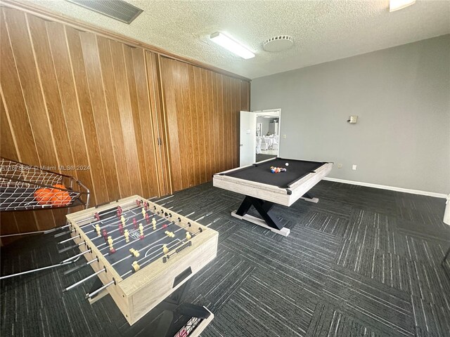 recreation room with a textured ceiling and pool table