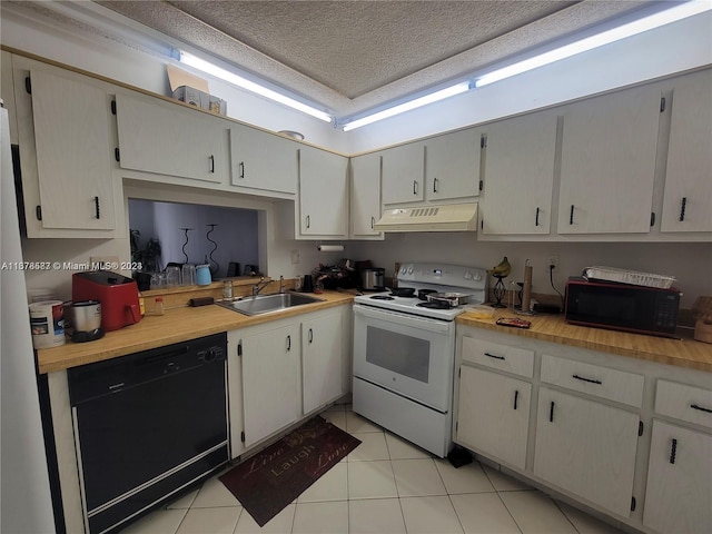 kitchen with black appliances, sink, and light tile patterned floors