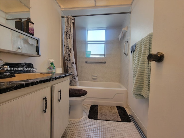 full bathroom featuring vanity, shower / tub combo with curtain, toilet, and tile patterned flooring