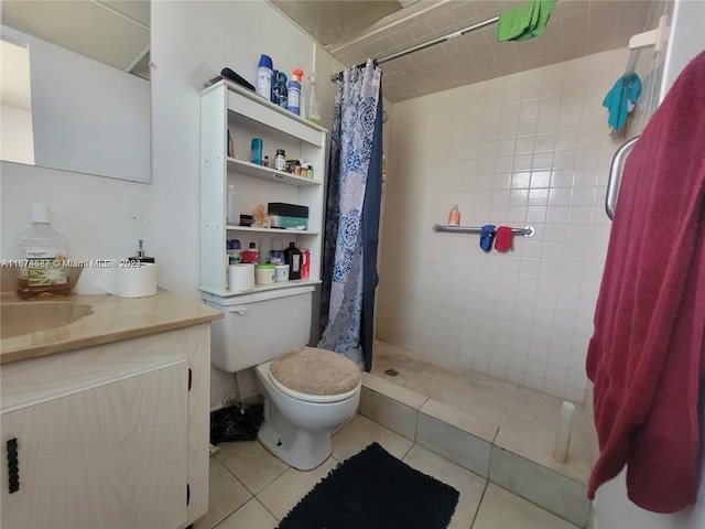 bathroom with vanity, toilet, tile patterned floors, and curtained shower