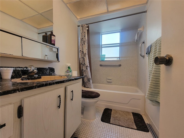 full bathroom featuring toilet, shower / bath combo with shower curtain, vanity, and tile patterned flooring