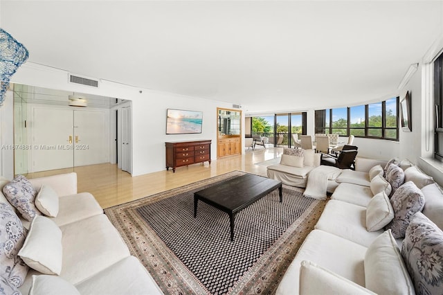 living room with light hardwood / wood-style flooring