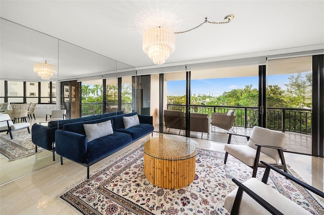 living room featuring a chandelier and a wall of windows