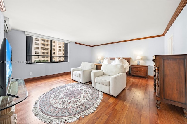 bedroom featuring crown molding and hardwood / wood-style flooring