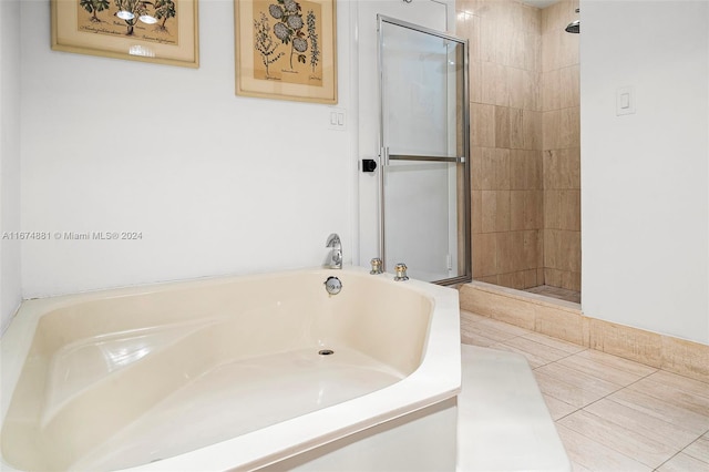 bathroom with plus walk in shower and tile patterned flooring