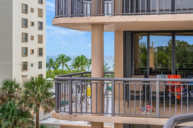 balcony featuring a water view