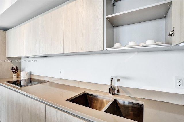 4111 S Ocean Dr Unit 1201, Hollywood, FL 33019 - kitchen featuring a sink, light countertops, modern cabinets, black electric stovetop, and open shelves
