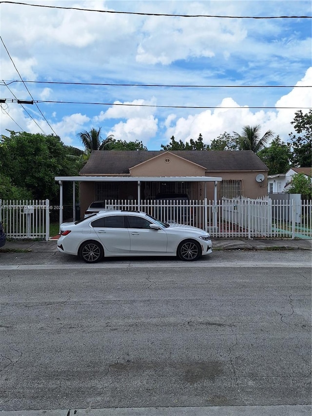 view of front of house with a carport