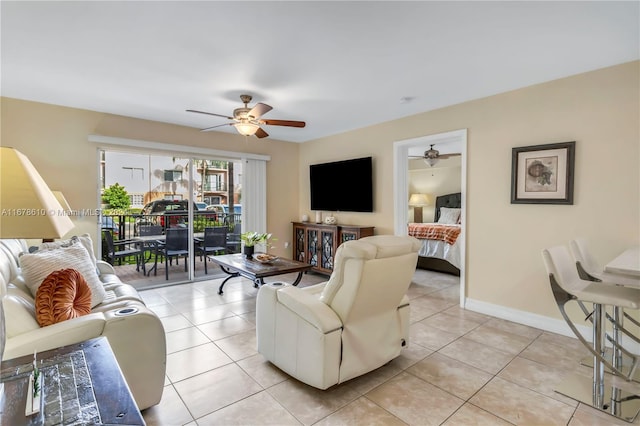 living room with light tile patterned flooring and ceiling fan