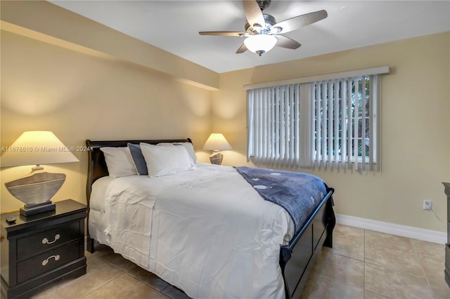 bedroom with tile patterned floors and ceiling fan