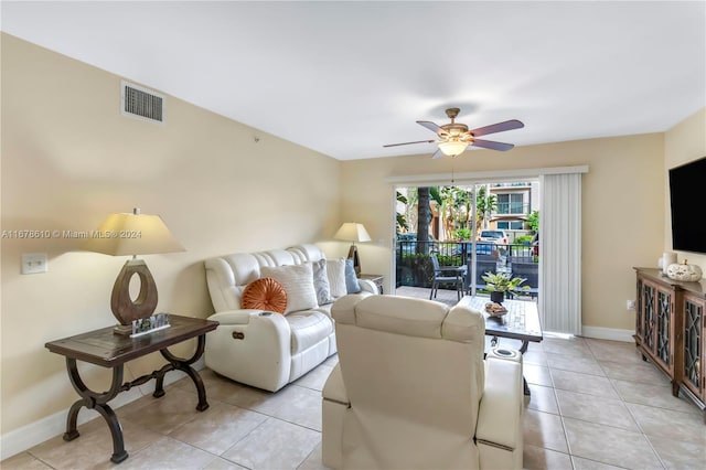 living room with ceiling fan and light tile patterned floors