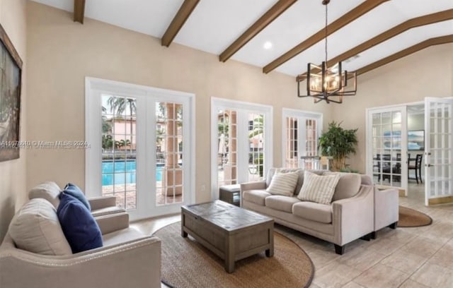 living room with light tile patterned flooring, french doors, lofted ceiling with beams, and a chandelier