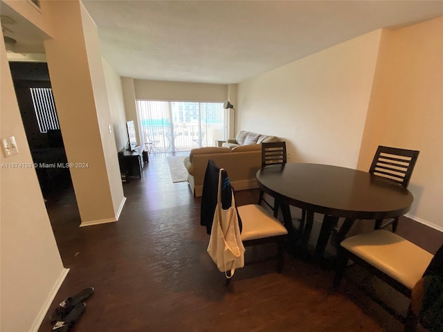 dining space featuring dark hardwood / wood-style flooring