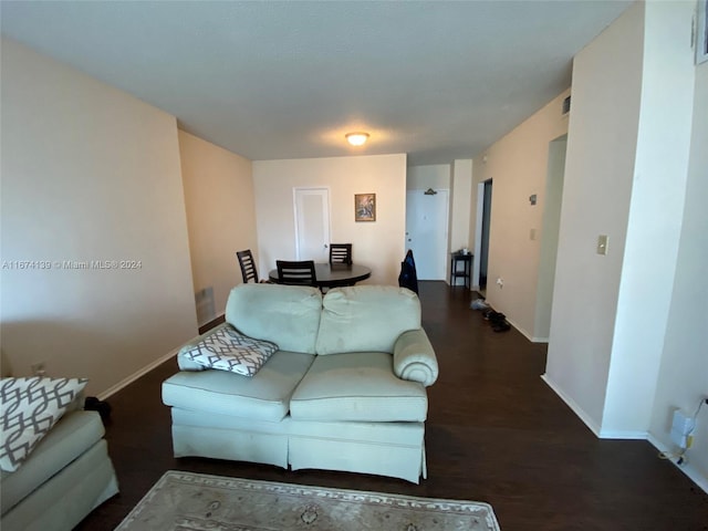 living room with dark hardwood / wood-style floors