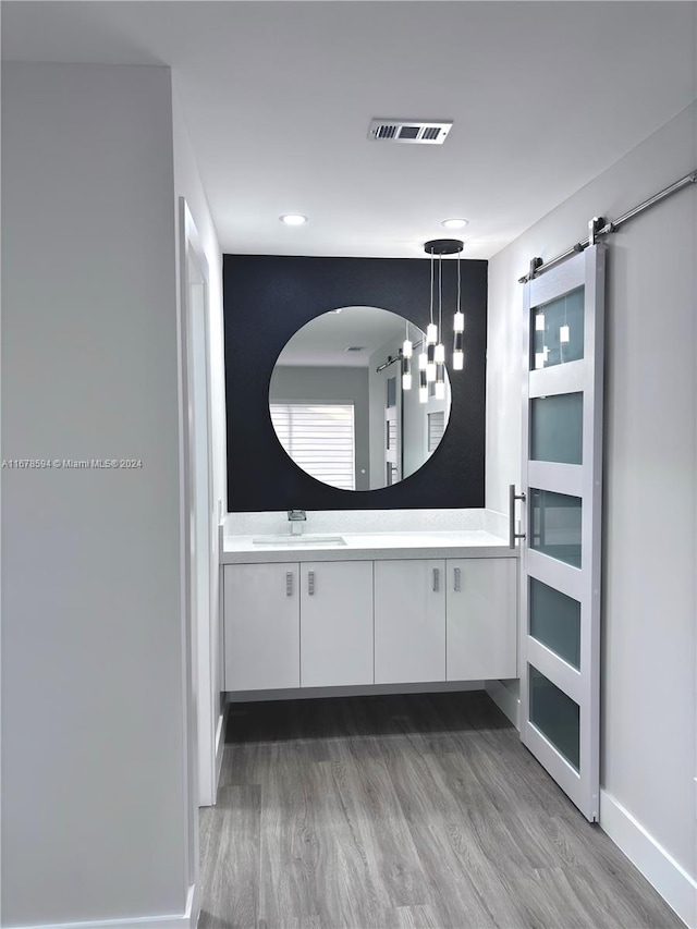 bathroom with vanity and hardwood / wood-style floors