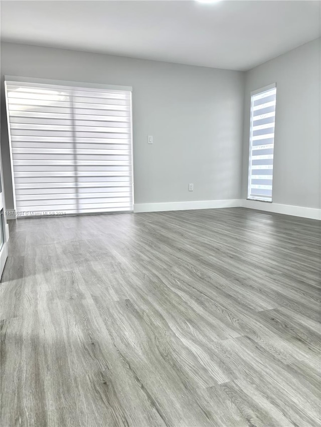 spare room with light hardwood / wood-style flooring