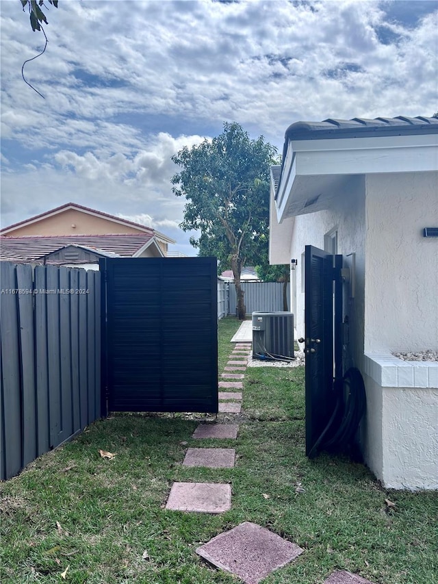 view of yard with central air condition unit