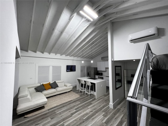 living room featuring an AC wall unit, lofted ceiling, and wood-type flooring