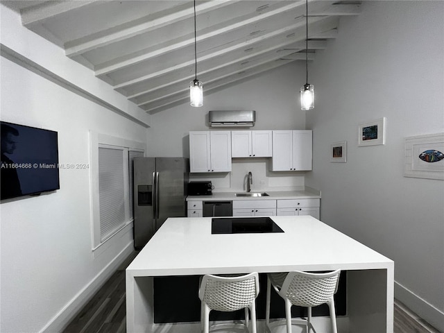 kitchen with white cabinetry, lofted ceiling with beams, black appliances, and pendant lighting