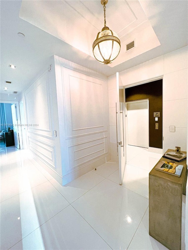 hallway with light tile patterned floors