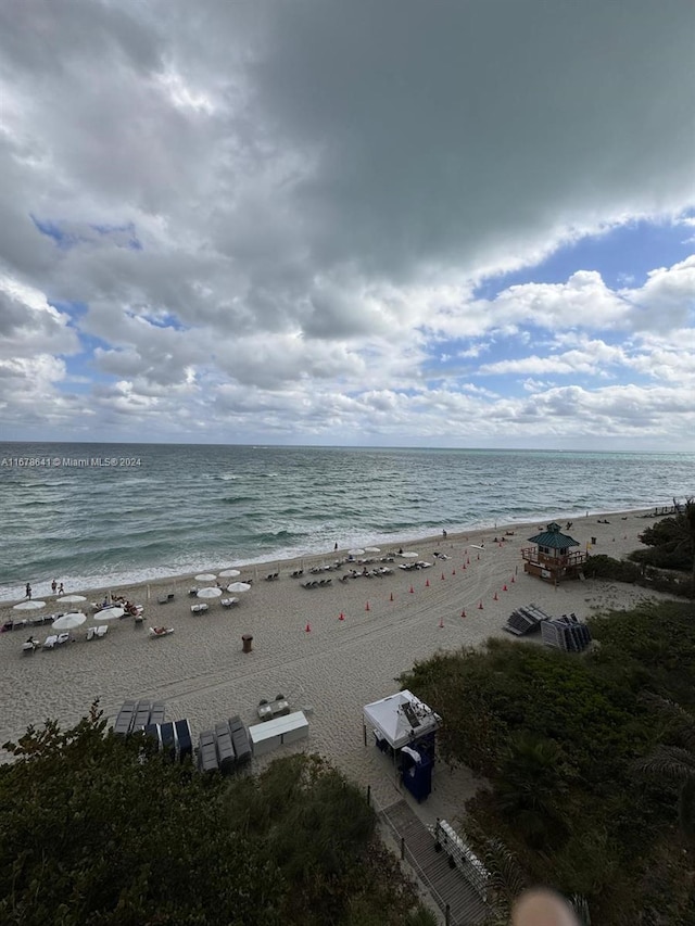 property view of water featuring a beach view