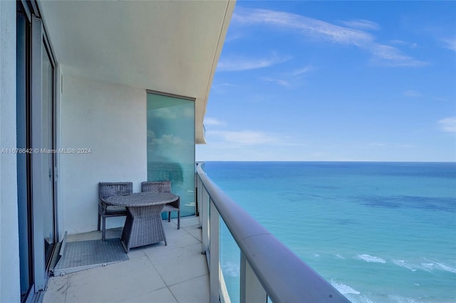 balcony featuring a water view