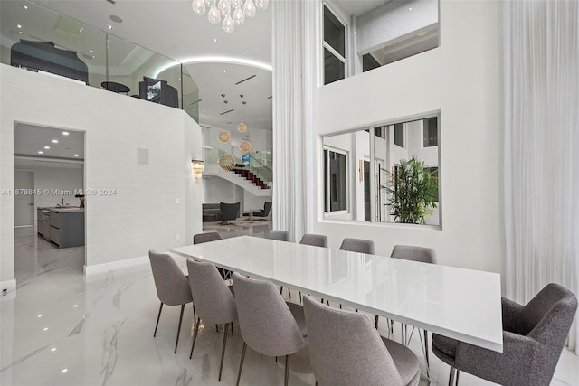 dining space featuring a high ceiling