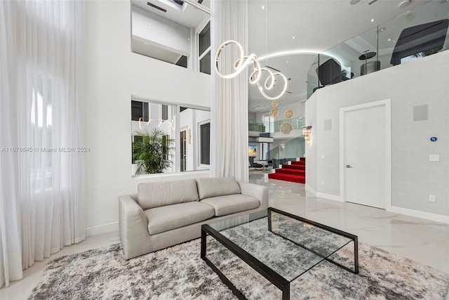 living room with a towering ceiling