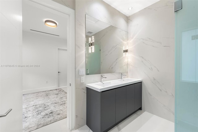 bathroom with tile walls and vanity