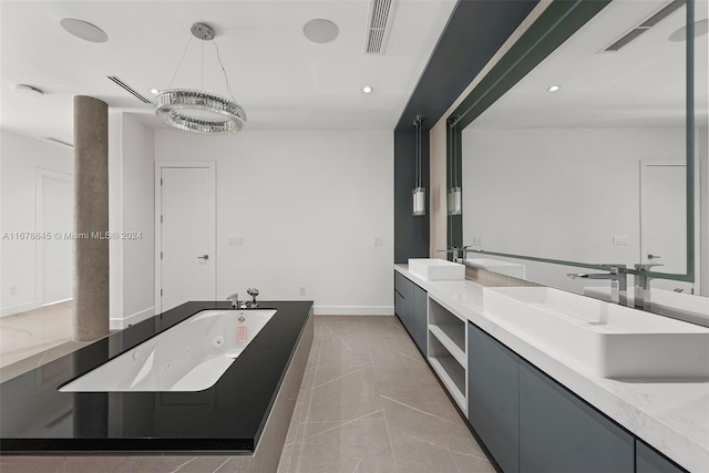 bathroom with vanity, a tub, tile patterned floors, and a chandelier