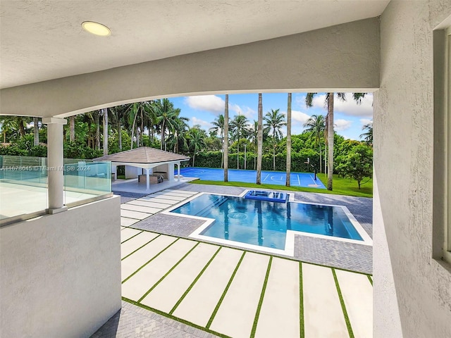 view of pool featuring a patio area