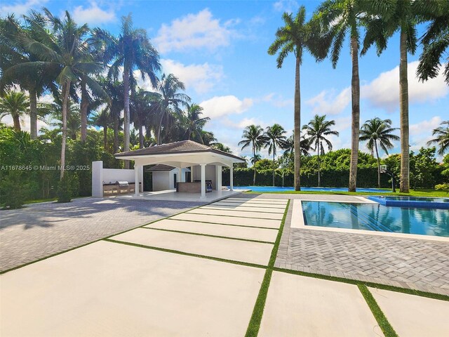 view of swimming pool featuring a patio area