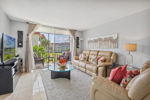 tiled living room featuring a textured ceiling