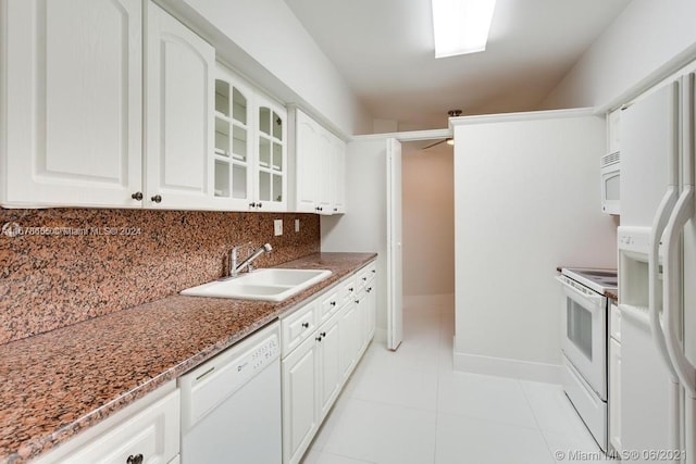 full bathroom featuring vanity, toilet, shower / bath combo with shower curtain, and tile patterned flooring