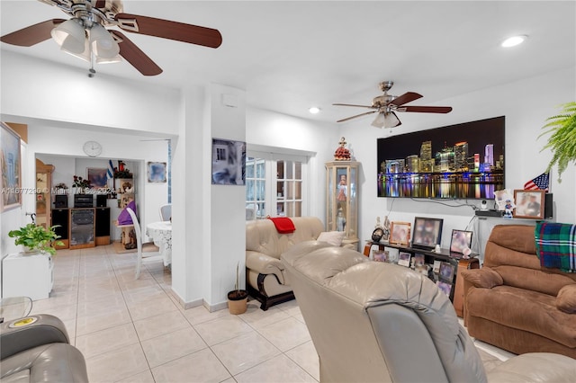 tiled living room with ceiling fan