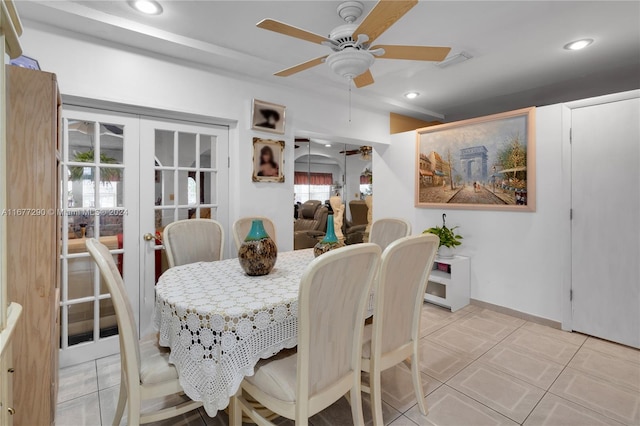 dining area featuring french doors, ceiling fan, and tile patterned floors