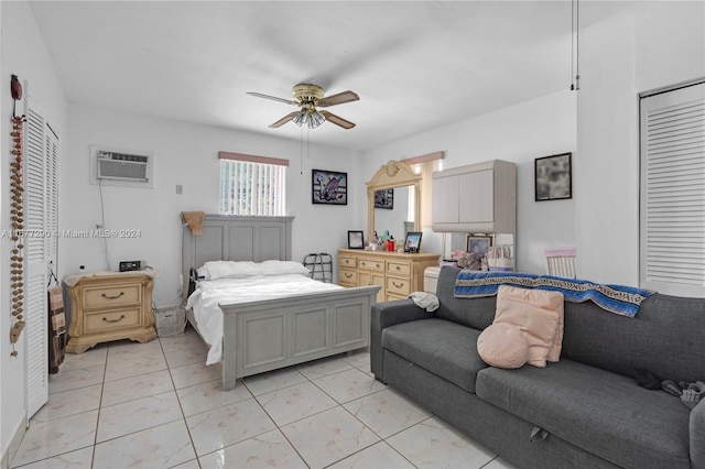 bedroom with a wall mounted AC and ceiling fan