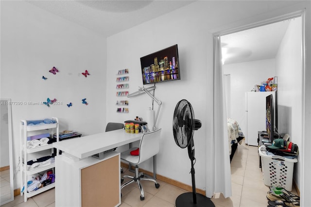 tiled home office featuring a textured ceiling