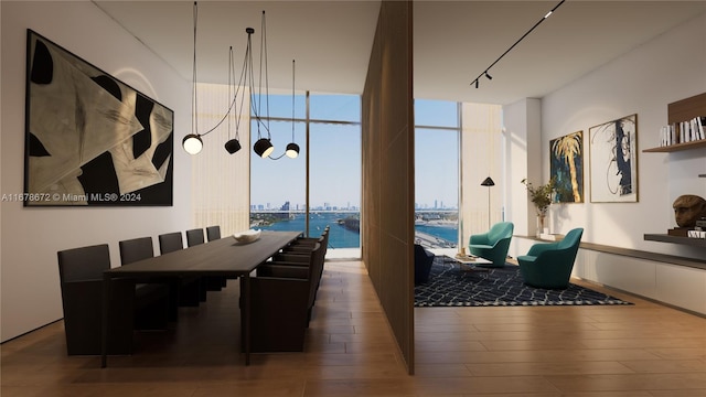 dining space featuring expansive windows, a water view, and dark hardwood / wood-style flooring