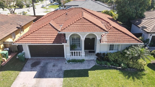 mediterranean / spanish house with a front yard