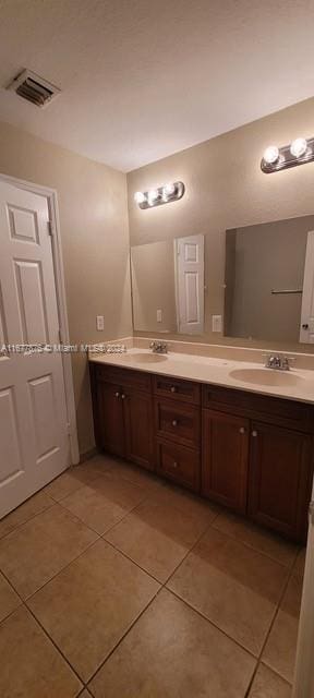 bathroom with vanity and tile patterned floors