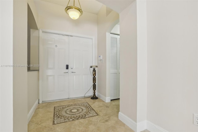 entrance foyer featuring light tile patterned flooring